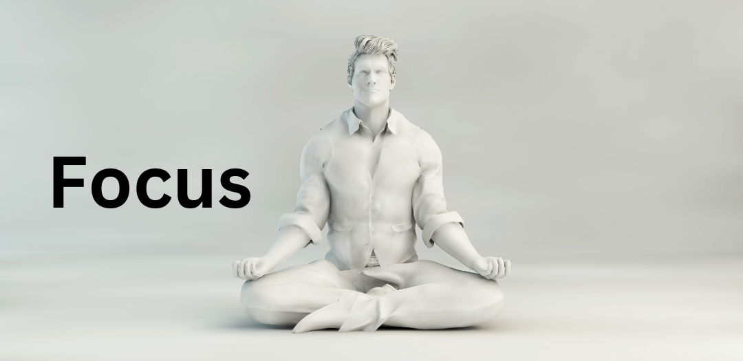 white statue of a man meditating in a cross-legged position next to the word "Focus"